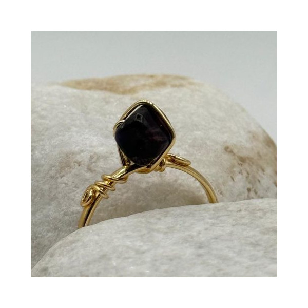 handcrafted gold ring with a deep black stone